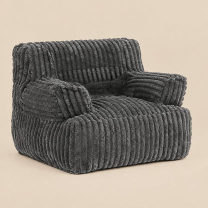 AURA | Pouf fauteuil faux fur dense et repose-pied | Nomaï – Gris foncé