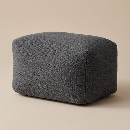 Pouf repose-pied extérieur Nomaï gris anthracite en tissu bouclé doux